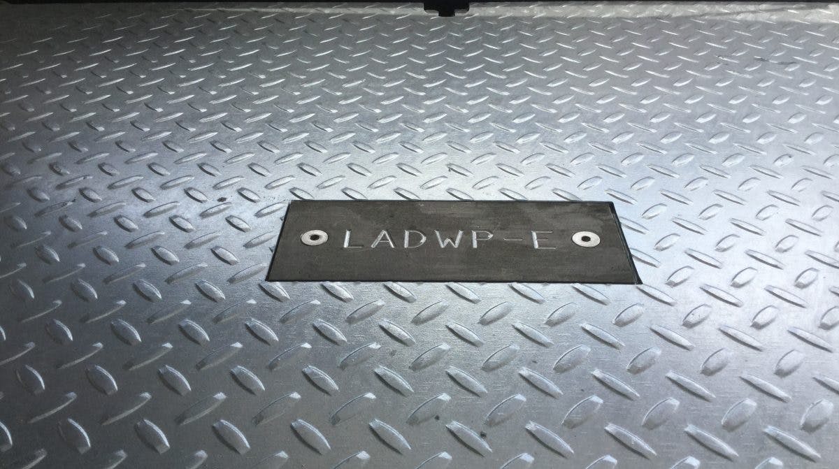 image of a metal access hatch with "ladwp-e" engraved into it.